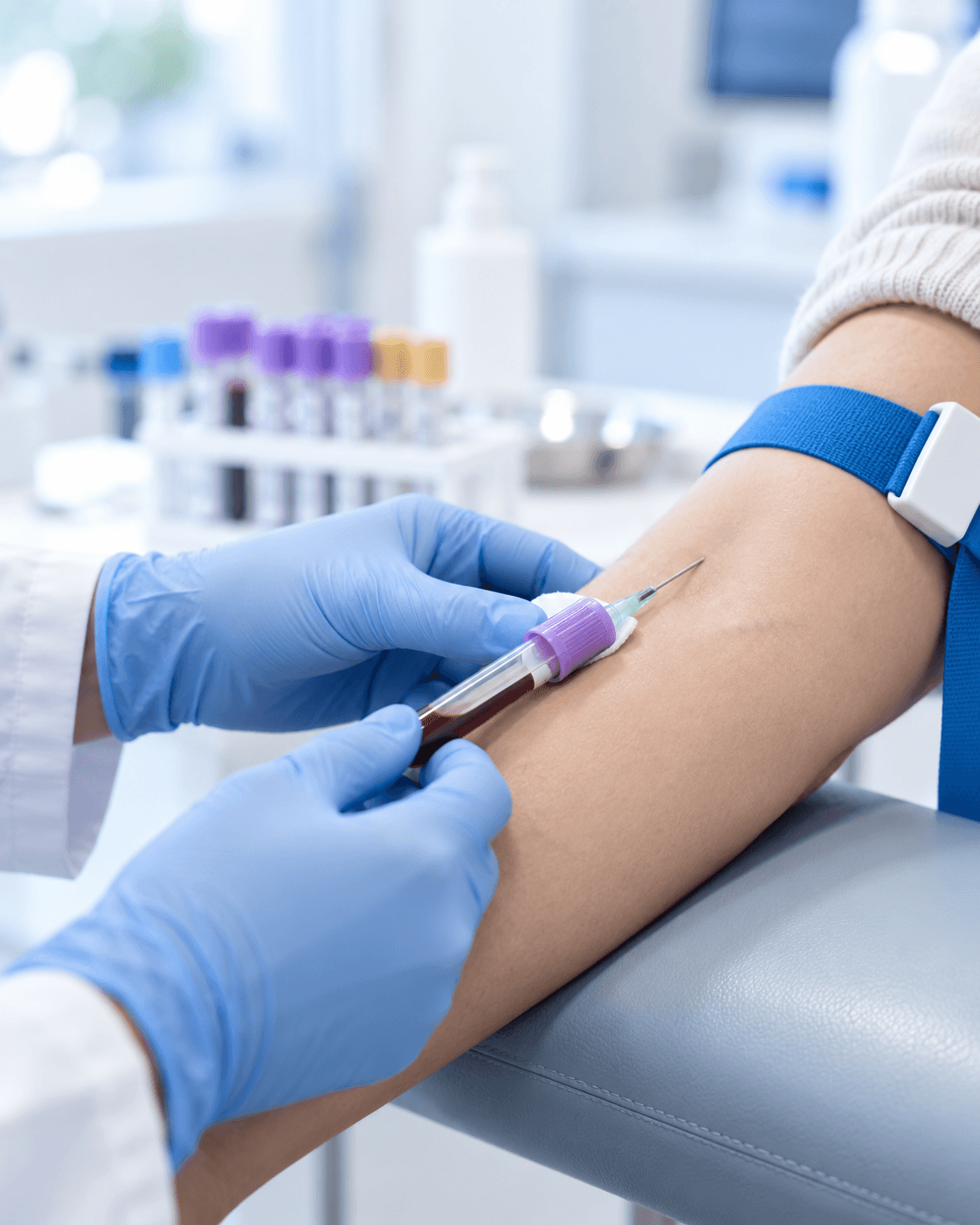 A healthcare professional collecting a blood sample